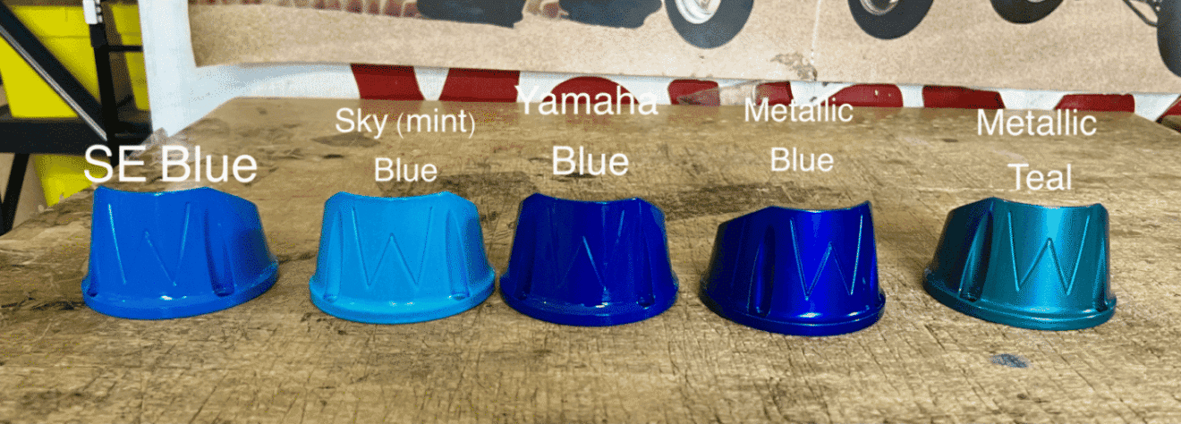 Five blue and teal painted caps displayed.